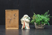 ふくよかなお顔立ちの縁起の良いお多福の置物(木箱付き) DC8602