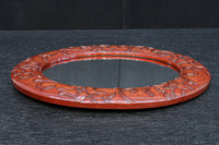 朱漆の花柄で華やかな面持ちの鎌倉彫の壁掛け鏡　DC8957