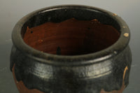 a small pot with a glaze and a delicious taste of a bottle of DB4150