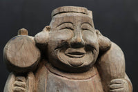 細目の笑顔で個性的な大黒様の木彫りの置物　DC1991
